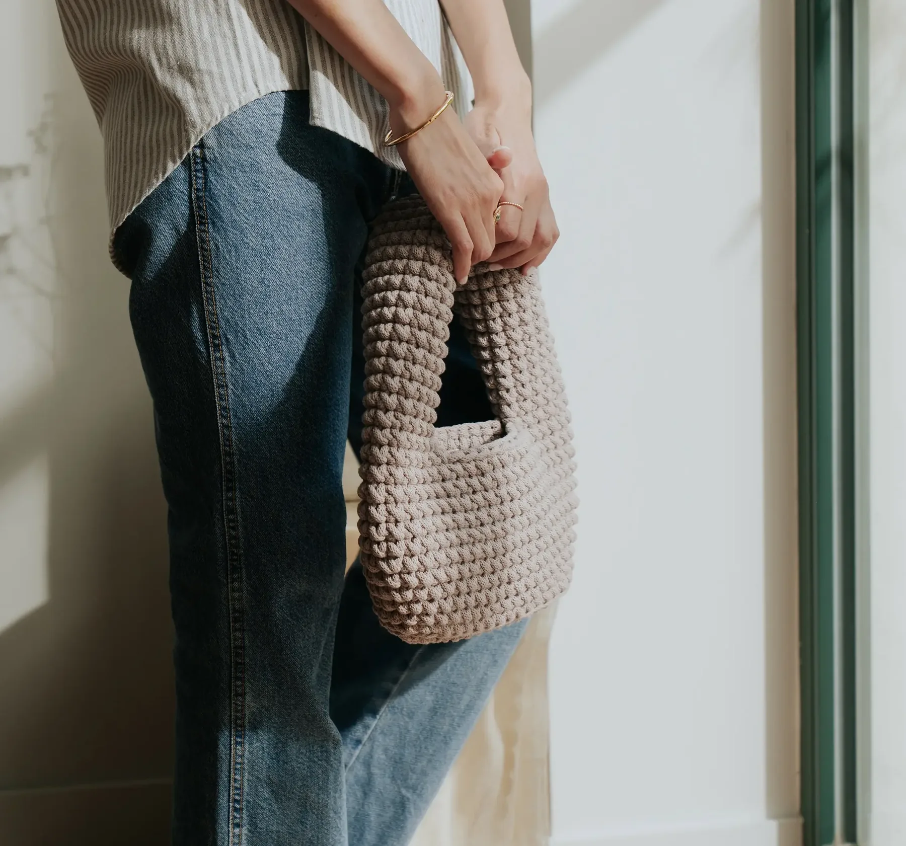 Close editorial view of the Capucine crocheted bag